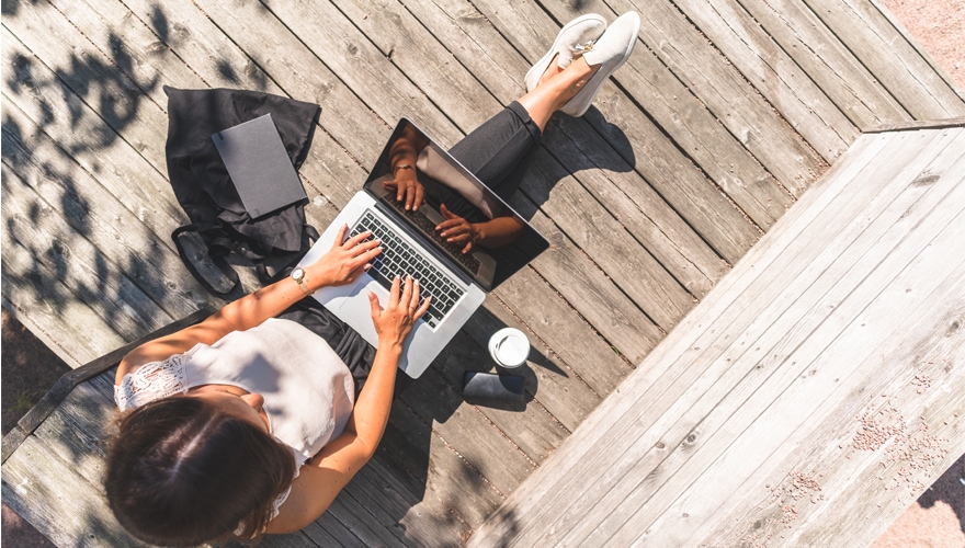 girl on laptop outside