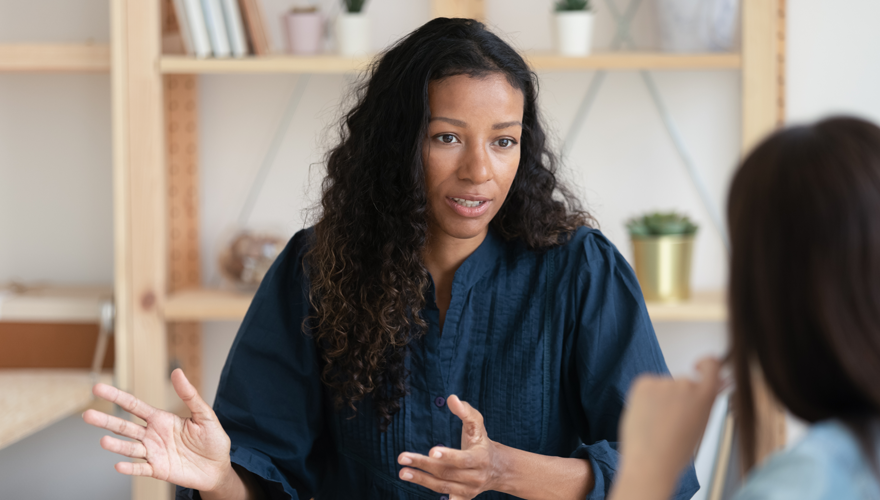 business woman speaking to colleague