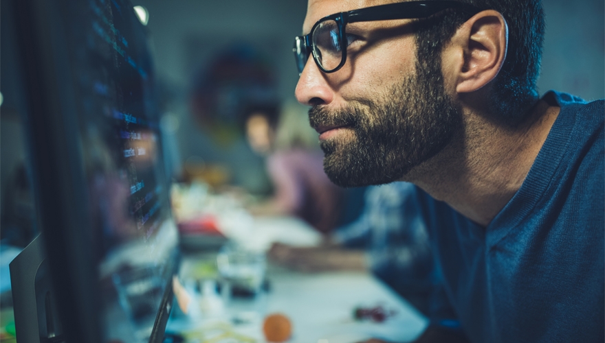 man looking at computer