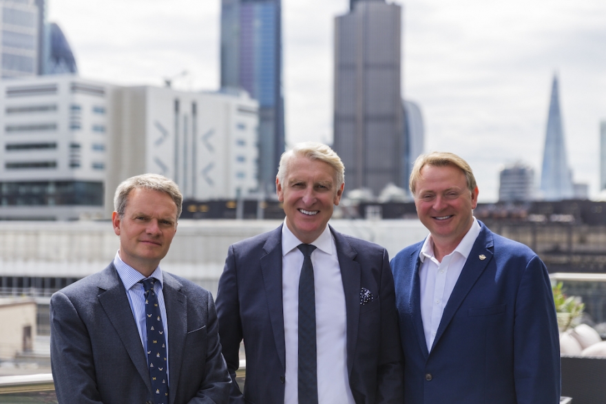 Suited businessmen against London skyline